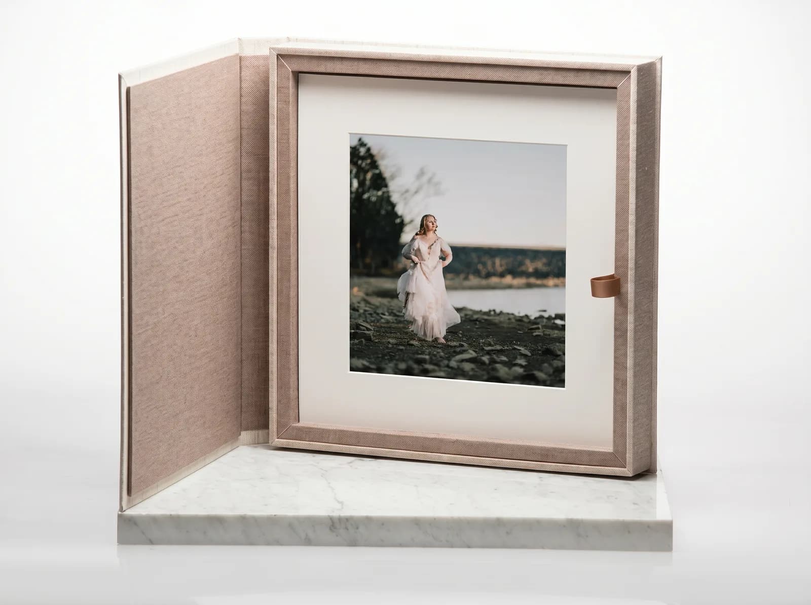 Mockup of a linen keepsake folio box standing open with a matted fine art print inside