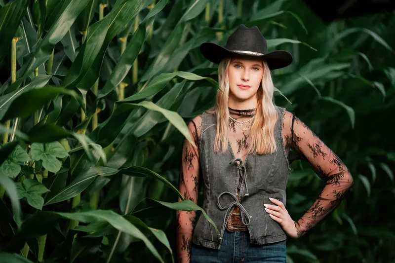 Senior portrait with dramatic compositional light