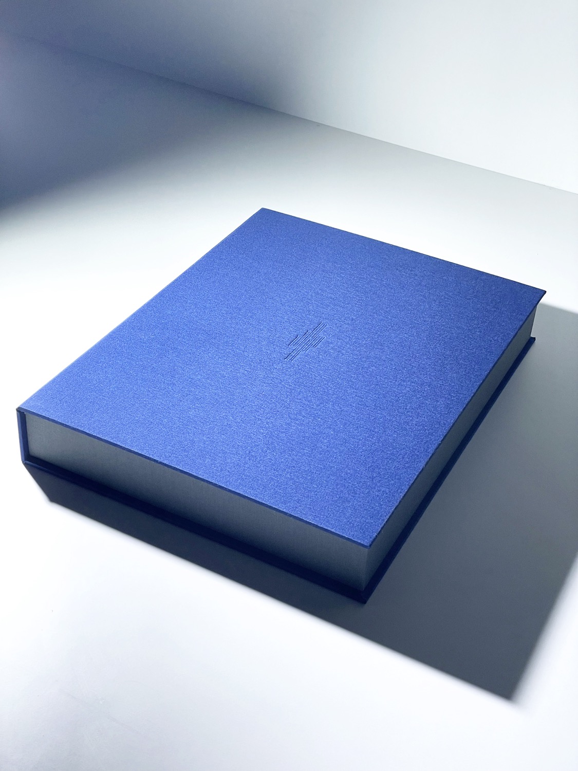Cobalt blue linen keepsake box embossed with the JR monogram