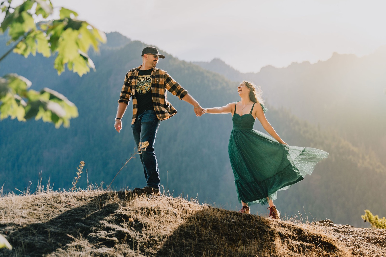 Couple on a rock overlook above Lake Crescent, Olympic National Park